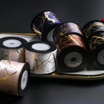 China Custom 4cm Iridescent High Quality Hot Stamping Gold Foil Marbling Printed Gift Wrapping Satin Ribbon Flower Bouquet Wrapping Ribbons for sale