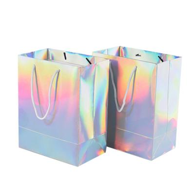 China Recycled Materials Manufactures Custom Colorful Christmas Gift Hardcover Rainbow Bags Laser Holographic Paper Bag For Cosmetic Jewelry Gift Packaging for sale