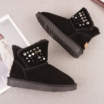 China 2021 fashion trend hardware and rivet decoration design woman famous brand leather boots Ugh for sale