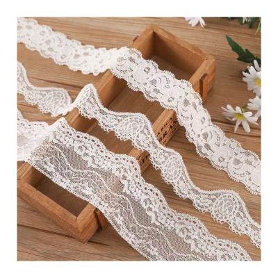 China Water Soluble Warp Stretch Lace Knitting Barcode For Underwear Swimsuit Fashion Clothes Lace Up Fabric White Extra Lace Material for sale