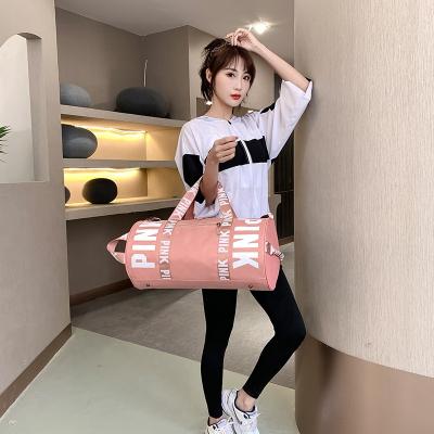 China Mala De Viagem Custom Logo Ladies Amazon Clearance Pink Multifunctional Girls Weekender Dance Bodybuilding Sports Gym Rolling Duffel Bag for sale