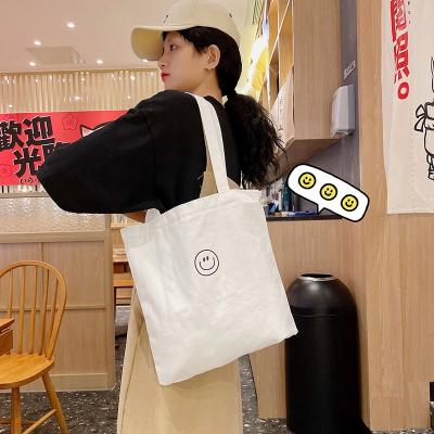 China Smiley Face Black White Heavy Duty Student School Cotton Retro Multifunctional Messenger Crossbody Large Tote Shopping Bag for sale