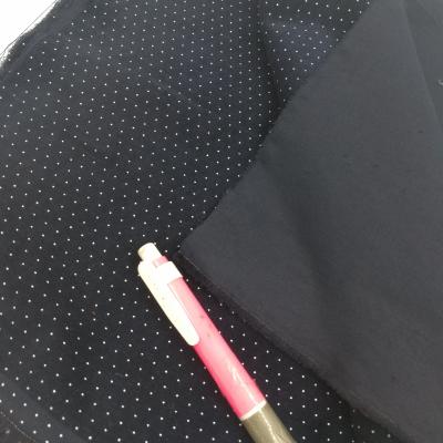 China Factory Wholesale 28 Wales Dump Printing White Anti Pill Dot Cotton Stretch Corduroy Fabric for sale