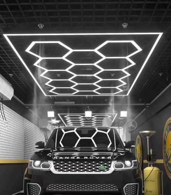 China Aoying Popular High Efficient Car Detailing Led Garage Light Honeycomb Led Garage Workshop Lights 14 Grid Hexagon Light System 8ft*16ft for sale