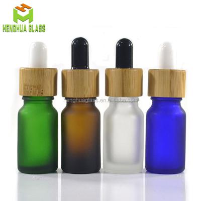 China High Quality Essential Oil Gel 10ml Glass Essential Oil Bottle For Luxury Bamboo Lid Black Matte Glass Dropper Bottle for sale