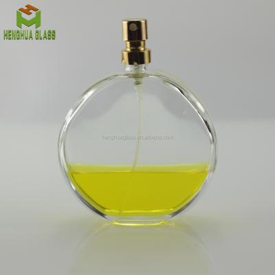 China Perfume 100ml round flattened polarized perfume bottle perfume spray glass packing glass bottle custom for sale