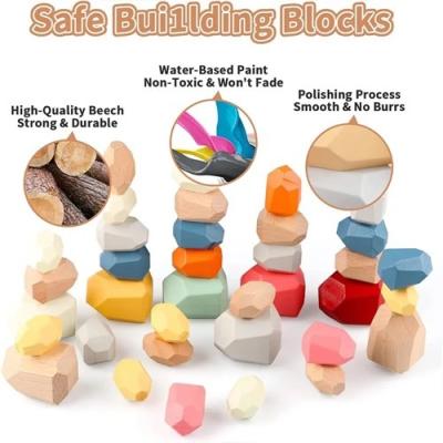 China 100% Eco-Friendly Rainbow Wooden Stones Block Colorful Wooden Building Block Assorted Stacking Rocks Balancing Stones Montessori Educational Toys for sale