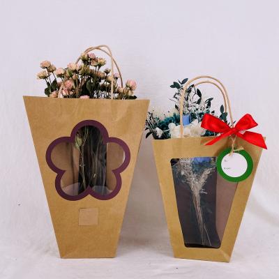 China Brown Paper Flower Bags From Europe Kraft Paper With Red Bowknot, Trapeze Bag For Clear Flowers Window With Paper Handle for sale