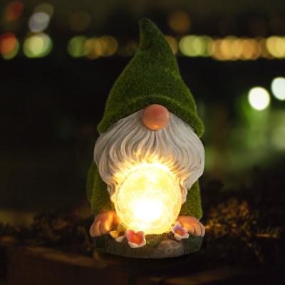 China With artificial moss covered outdoor yoga garden decor polyresin gnome statue flocked dwarf with solar light for sale