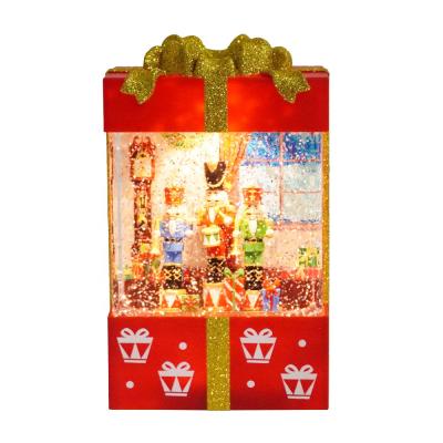 China With Led Christmas Nutcracker Water Light Glitter Rotating Gift Box Led Water Lamp Christmas Snow Globe for sale