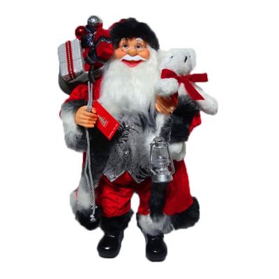 China Christmas gifting 60cm Christmas Indoor Traditional Wholesale Decor Figurine Santa Claus Standing Cloth Decor Holding Santa Claus Doll With Cloth Cloth for sale