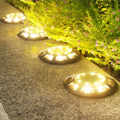 China Solar Garden 12 LED Ground Lights Waterproof Underground Sensing Landscape Lights Solar Garden Light for Lawn Pathway for sale