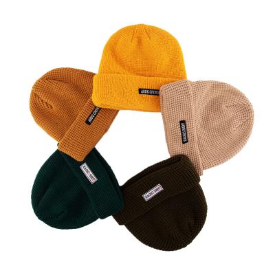 China COMMON Newly Customize Design Your Own Brand Knitted Winter Designer Hats Logo Waffle Knit Beanie Custom for sale