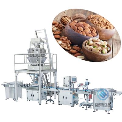 China Automatic weighing filling and sealing packaging machine for dry fruit and nut packing line Te koop