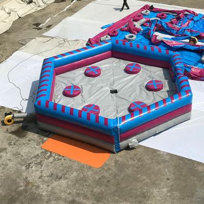 China Adult Mechanical Wipeout Melting Games Inflatable Tower Fire Resistance Carnival Sweeper Emilinator for sale