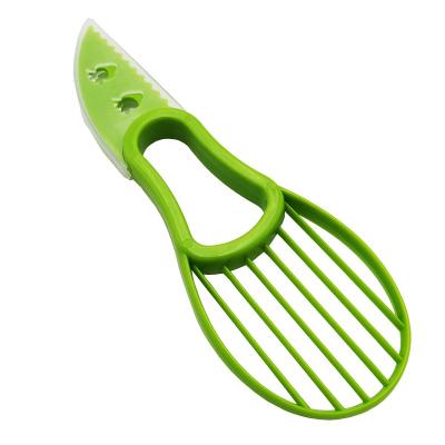 China Viable multi-functional fruit cutter avocado household knife special avocado slicer 2 in 1 avocado slicer for sale