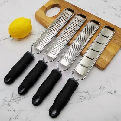 China Viable Multifunctional Zesting Tools Lemon Zester Kitchen Cheese Grater With Cover Device for sale