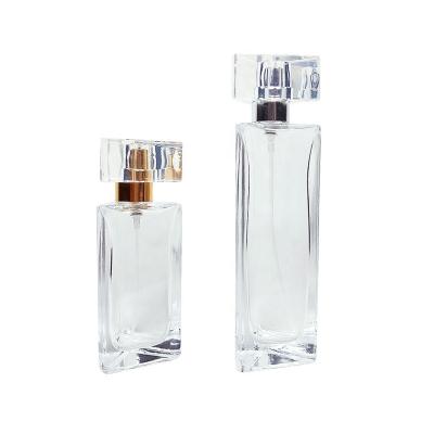 China 30ml Perfume Glass Cosmetic Hot Selling Trigone Bottle 40ml Empty Pussy Perfume Glass Atomizer With Spray Pump for sale