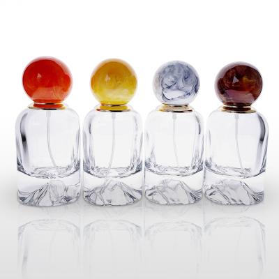 China New Volcanic Bottom Clear White Material Glass Perfume Bottle 50ml Personal Care Perfume Bottle Bayonet Perfume Bottle Resin Cap Model for sale