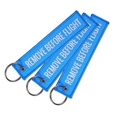 China Sew On Cheap Custom Fabric Woven Jet Tag Logo Keychain Jet Tag Woven Non Woven Key Chain Cheap Fashion Jet Tag for sale