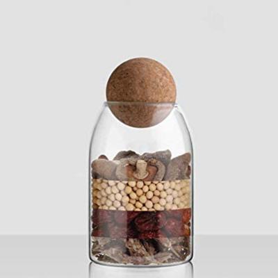 China Viable Clear Canister Food Storage Canister Mason Jar Candy Kitchen Glass Jar With Airtight Seal Lid Wood Ball for sale