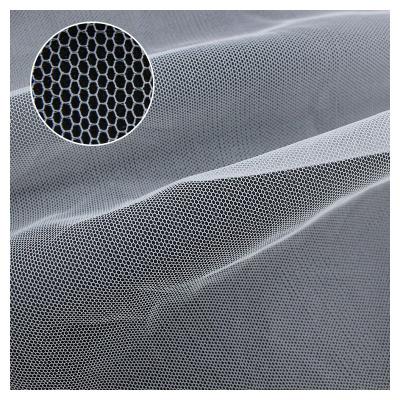 China Profession Soft Tear-Resistant Warp Knitted Tear Resistant Hexagon 100% Polyester Tulle Fabric For Wedding Dress for sale