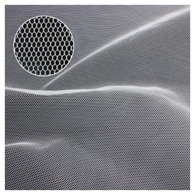 China Good Quality Stiff Hexagonal Breathable 100% Polyester Tear-Resistant Warp Knitted Tulle Fabric For Lingerie for sale