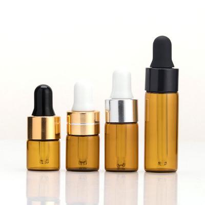 China Mini 1ml Cosmetic Essential Oils Perfume Hair Amber Cosmetic Sample Dropper Glass Bottle for sale