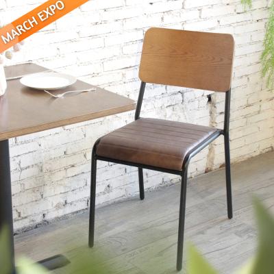 China High Quality Industrial Style Metal Frame Stacking Chair With Plywood Back Vintage PU Leather Dining Chairs for sale