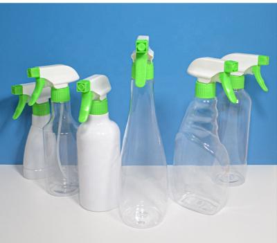 China Empty Household Cleaning Products 500ml Liquid Container With Transparent And White Bottle Body And Green Pump for sale