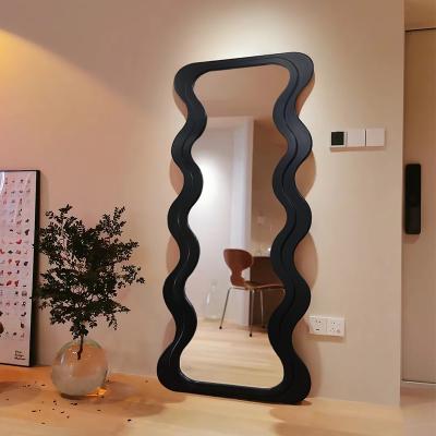 China OEM Floor Wavy Standing Mirror Black Ornate Wooden Frame for sale