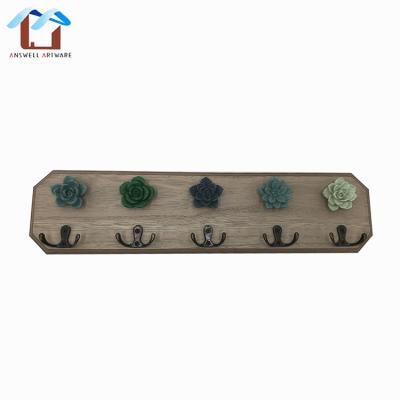 China Simple Home Hanger Sustainable Gancho De Madera Flowers Decorative Wooden Wall Hanger Coat And Hat Hooks for sale