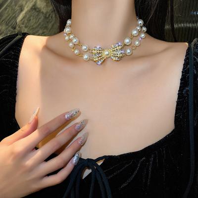 China Luxury Temperament Double Pearl Diamond Bowknot Clavicle Chain Elegant Fashion Light TRENDY Design Necklace for sale