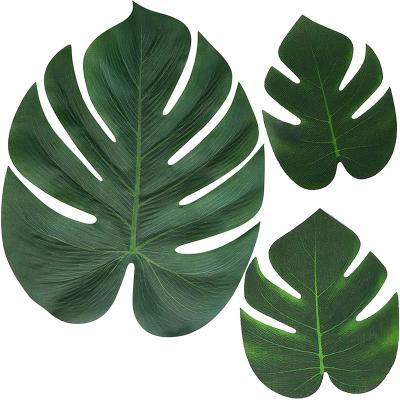 China Juli Hot Selling Multiple Sizes Environmental Friendly Tropical Artificial Palm Leaves for Hawaii Birthday Party Wedding Table Decoration for sale