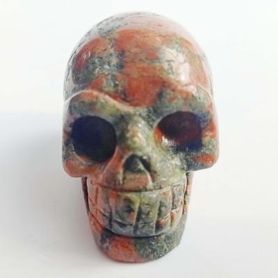 China China wholesale natural crystal carved skulls dragon blood stone hand-carved Hand-carved skulls for sale