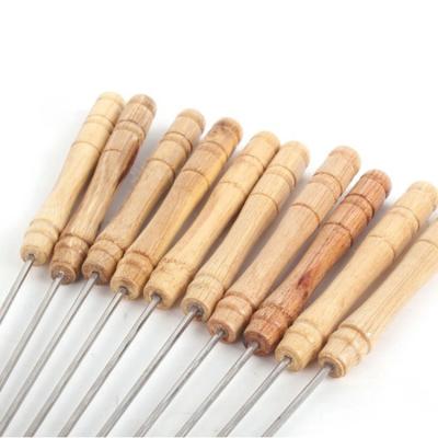 China Wholesale Easily Cleaned Non Magnetic Wooden Handle Spikes Stainless Steel BBQ Skewer for sale