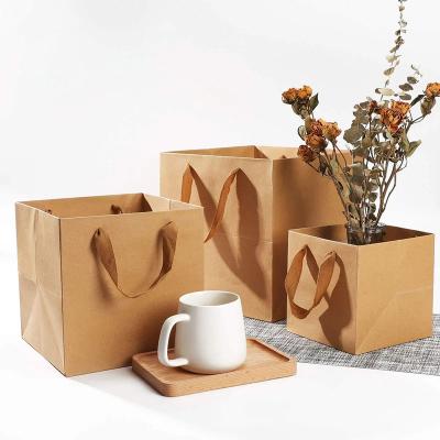 China Custom Logo Printed Recycled Materials Take Away Food Packaging Bag White Brown Kraft Paper Shopping Recycled Shopping Paper Bag With Handles for sale