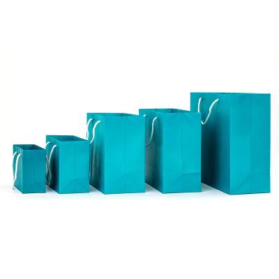 China High Quality Recycled Materials Customize Design Portable Fashion Clothes Storage Bags Blue Kraft Paper Bags For Shopping for sale