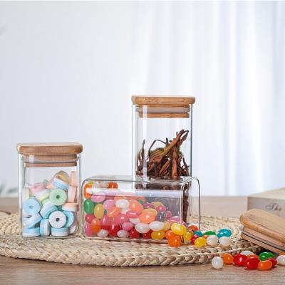 China Freshness Preservation Wholesale Borosilicate Glass Empty Square Storage Sealed Jar With Bamboo Lid for sale