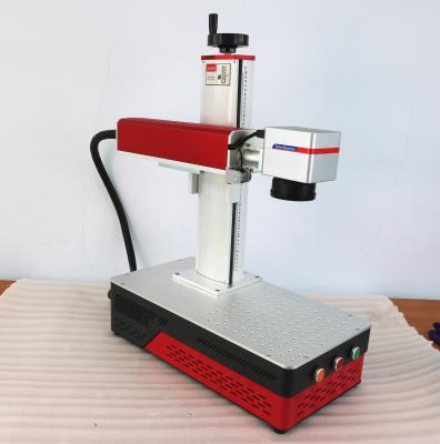 Chine Mini machine de marquage au laser à fibre de bureau tout en un MAX Raycus JPT 20W 30W 50W avec axe rotatif à vendre