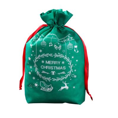 China Christmas Pattern Disposable Shopping Bags Ready To Ship Stock Christmas Gift Nonwoven Drawstring Bag for sale