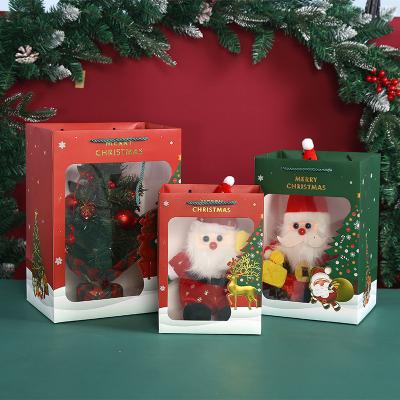 China Christmas Eve Apple Bags Gold Stamp Paper Santa Claus Elk With Window Christmas Gift Transparent Handbag for sale