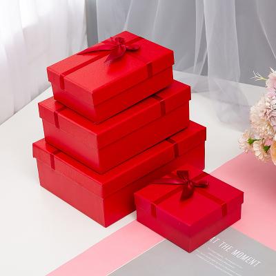 China Recycled materials birthday gift box in stock red gift box set business wedding bow gift box high-end handbag can be customized for sale