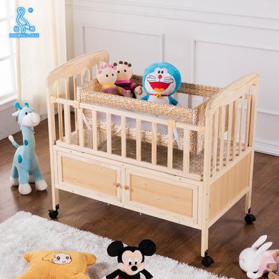 中国 Durable Multifunctional Baby Crib Wooden Baby Bed with Mosquito Net and Drawers 販売のため