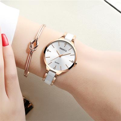 China Alarm Nibosi 2330 OEM Adjustable Magnetic Strap Watch Magnet Strap Starry Milanese Ladies Watch for sale