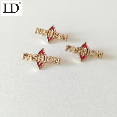 China Viable Manufacturer Logo Custom Metal Label Fashion Swimwear Designer Gold Alloy Label Tag For Clothes for sale