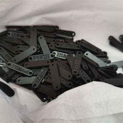 China USA Sustainable Standard Environmental Custom Brand Clothing Alloy Logo Labels For Coat / Swimwear for sale