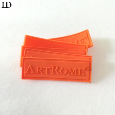 China Viable Sew On 3d Label , Silicone Rubber Custom Logo Eco Friendly Soft Material PVC Rubber Labels With Embossed Logo for sale