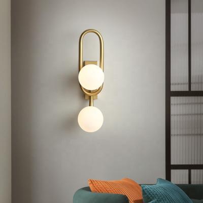 China Simple Modern Nordic Gold Magic Simple Bean Glass Wall Lamp Bedside Background Aisle Corridor Wall Lights for sale