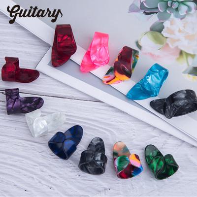 China Music Enlightenment Colorful Popular Well-designed Celluloid Finger Thumb  Guitar Picks for sale